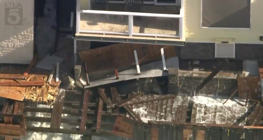 Beachfront home on brink of collapse as tropical storm batters Southern California