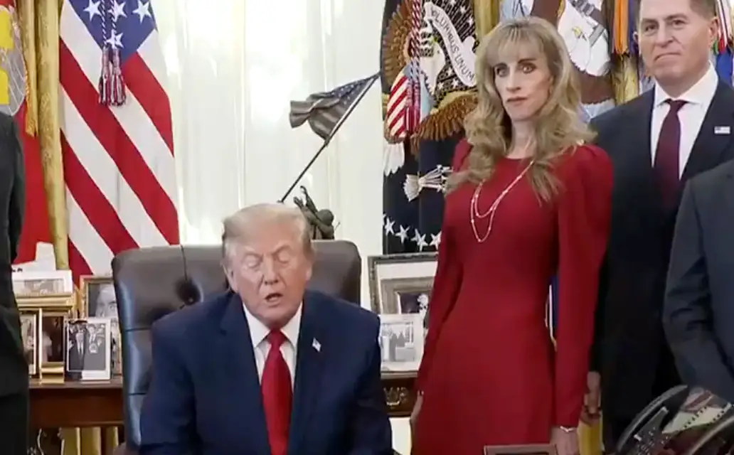 Who is the woman standing with Trump in 'weird' White House clip dubbed 'not real'