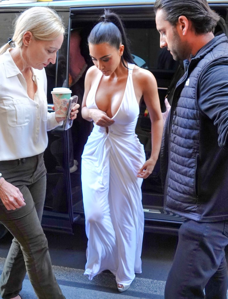 Kim Kardashian wows in plunging white gown while shopping in Rome