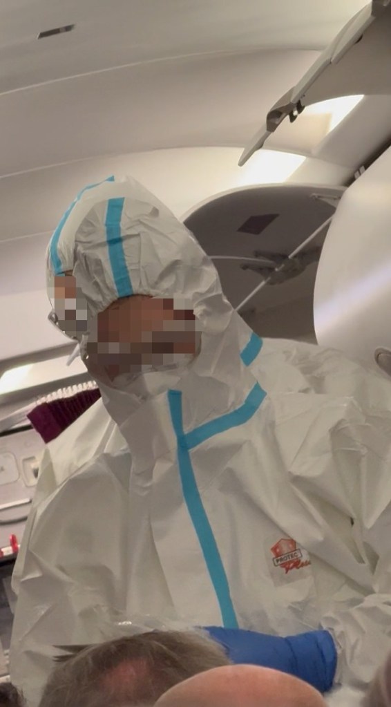 Medics in hazmat suits board plane as suspected norovirus leaves passengers violently sick on flight