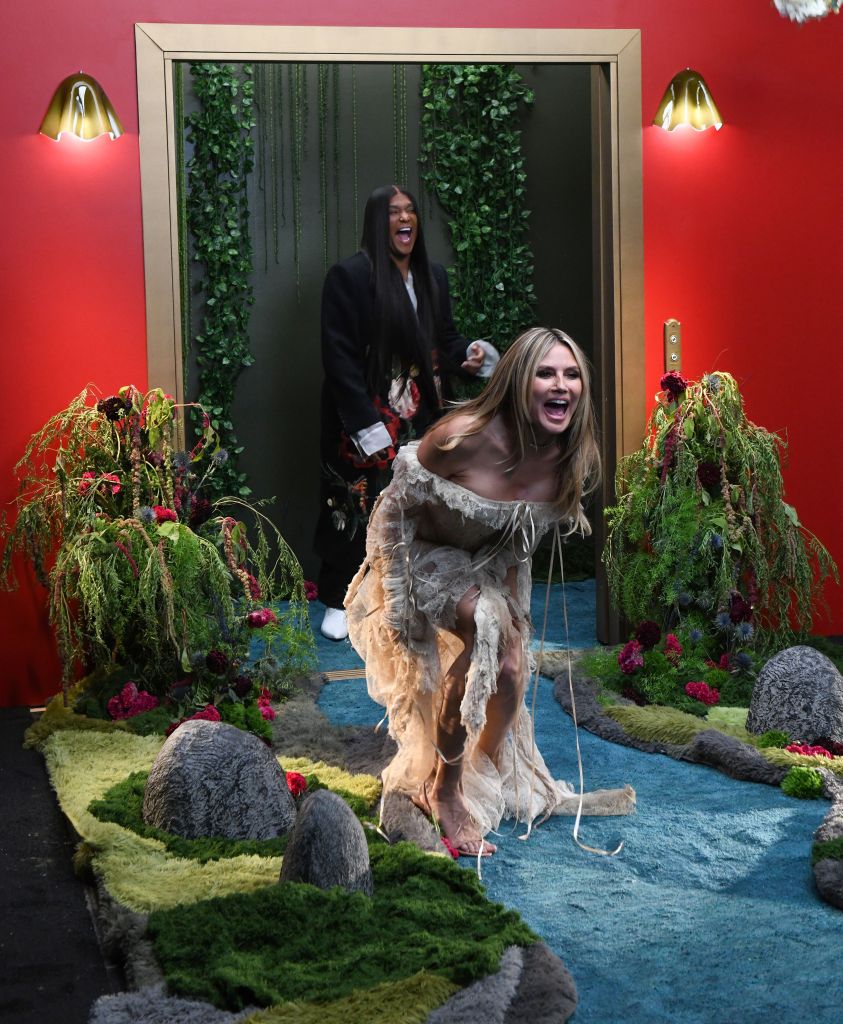 Heidi Klum’s tattered, stained lace corset gown looks like it survived a shipwreck