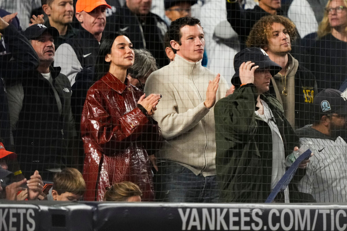 Dua Lipa sports $15K Chanel coat at Yankees playoff game with husband Callum Turner