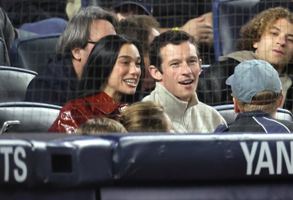 Dua Lipa sports $15K Chanel coat at Yankees playoff game with husband Callum Turner