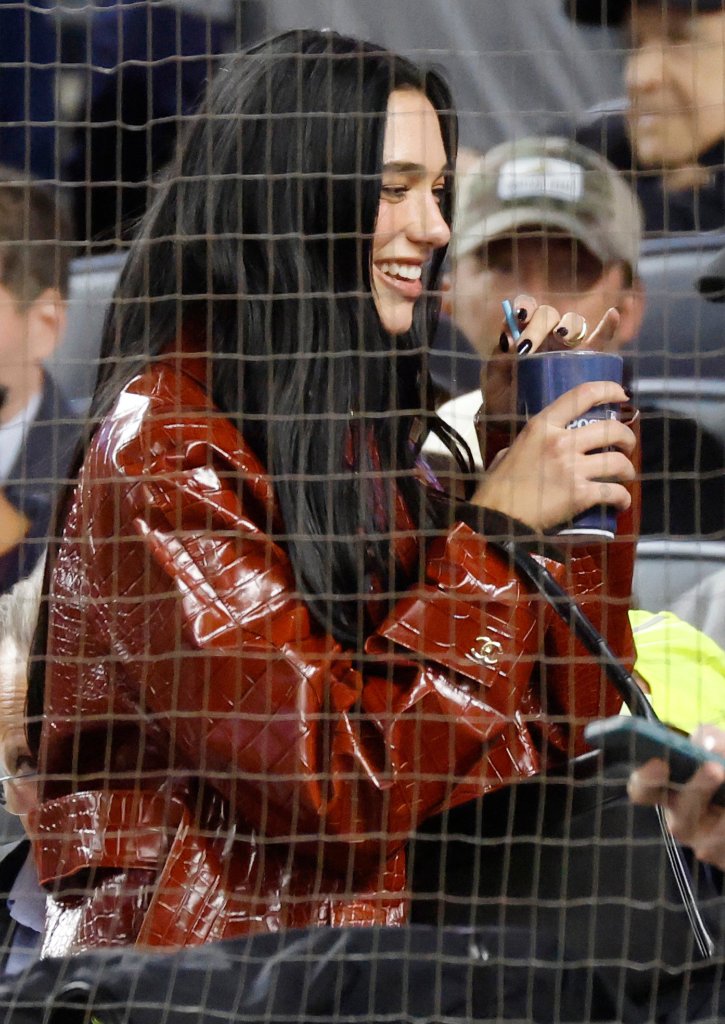 Dua Lipa sports $15K Chanel coat at Yankees playoff game with husband Callum Turner