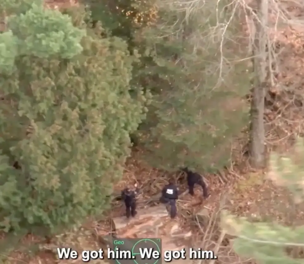 Police helicopter footage captures moment escaped inmate is found hiding