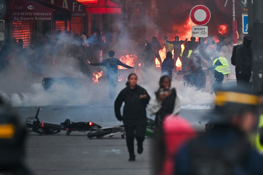 US radicals headed to France to join cop-bashing protests are planning to bring riots to our shores