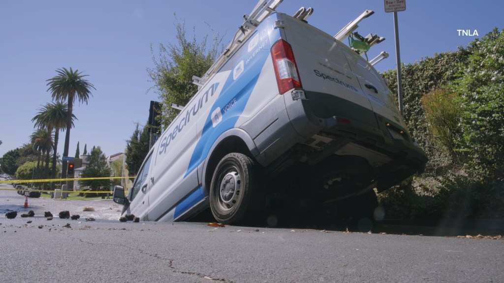 Massive sinkhole opens up on busy Los Angeles street swallowing entire van