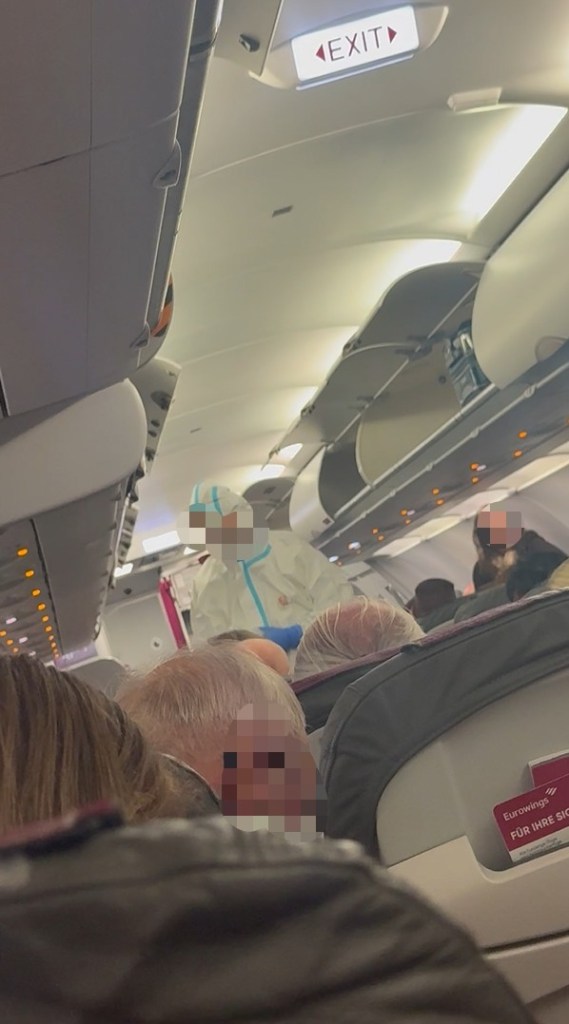 Medics in hazmat suits board plane as suspected norovirus leaves passengers violently sick on flight