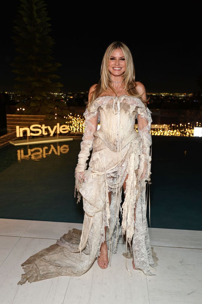 Heidi Klum’s tattered, stained lace corset gown looks like it survived a shipwreck