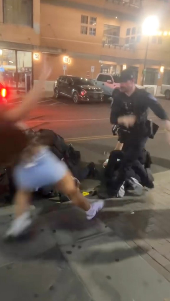 Viral video captures Arizona State University cheerleader being shoved to ground, pummeled by cops