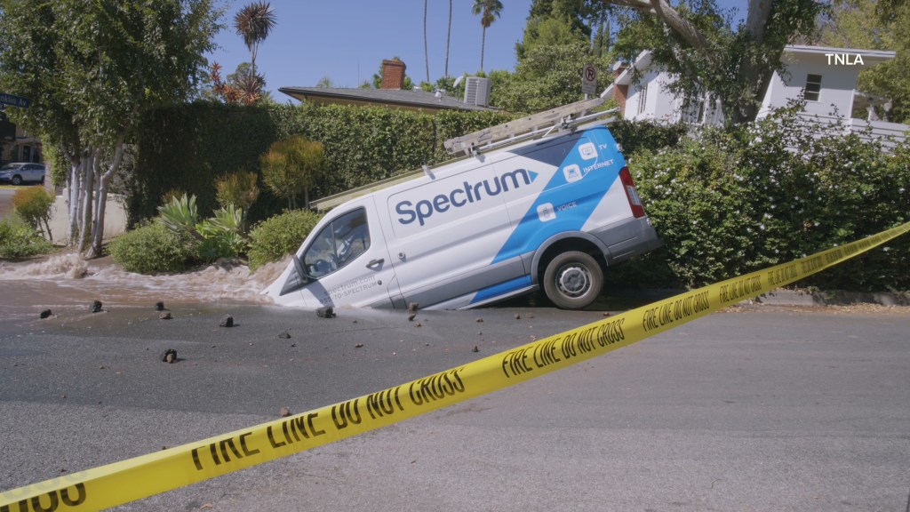 Massive sinkhole opens up on busy Los Angeles street swallowing entire van