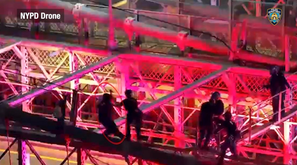 Drone footage captures moment police fatally shoot knife-wielding nut — as he lunges at them from atop the Brooklyn Bridge