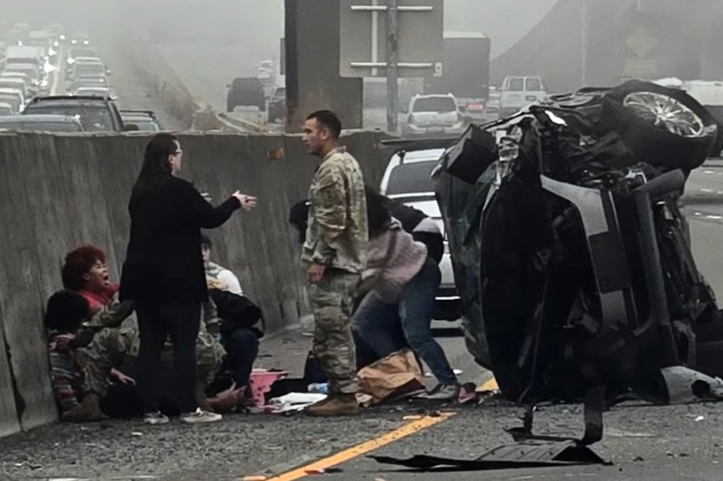 Woman allegedly stabs girl after SUV hits semi as soldiers step in to stop horrific roadside attack
