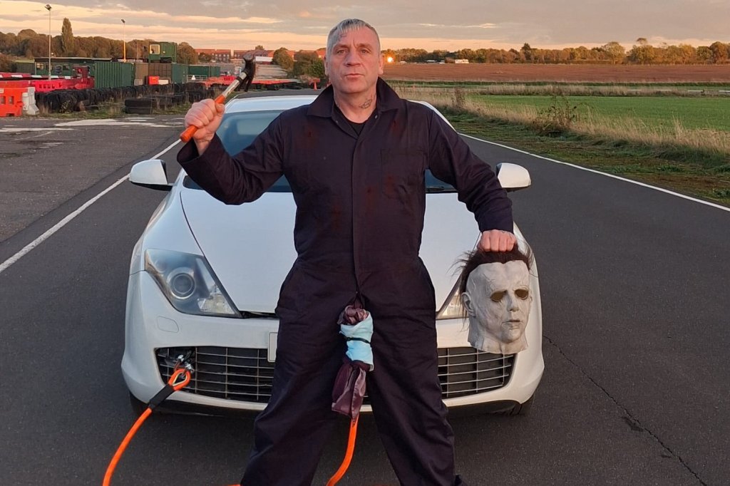 Strongman in Michael Myers Halloween costume pulls car with his penis — for a good cause: ‘Harder than it looks’ 